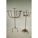 A wrought iron six light pricket candlestick, A/F, together with a smaller five light pricket