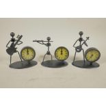 A set of three metal figural clocks of musicians, 5½" high