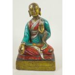 A painted bronze figure of Buddha seated in meditation, 9½" high