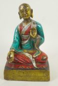 A painted bronze figure of Buddha seated in meditation, 9½" high