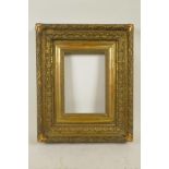A good C19th gilt composition picture frame with raised leaf and corner ribbon decoration, 9¼" x 6½"