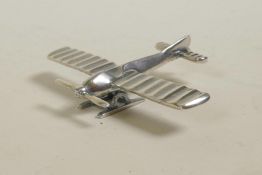 A miniature 925 silver model of a propeller plane, 1½" long