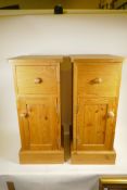A pair of pine bedside chests of small proportions, on plinth bases, 15" x 12", 28" high