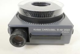 A Kodak Carousel 5-AV 2020 projector, in a fitted case