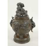 A Japanese bronze censer and cover, the body with applied decoration of birds and two floral
