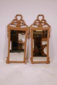 A pair of giltwood pier glasses, with ribbon and rope decoration, A/F losses to base mouldings,