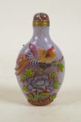 A Peking glass snuff bottle with raised and enamelled decoration of Asiatic birds and flowers, 3½"