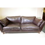 A contemporary brown leather two seater sofa, 84" wide