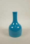 A Chinese turquoise glazed mallet shaped porcelain vase, 6 character mark to base, 8½" high