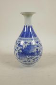A Chinese blue and white pear shaped vase decorated with a phoenix and lotus flowers, 6 character