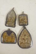 Four unusual Tibetan Buddhist pendants, largest 3" long