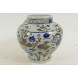 A Chinese porcelain jardiniere with mottled blue glaze and panels of birds and flowers, 8" diameter