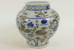 A Chinese porcelain jardiniere with mottled blue glaze and panels of birds and flowers, 8" diameter