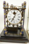 A replica Rolling Ball clock in brass and glass case, 16" high, 10" square