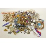 A collection of costume jewellery to include necklaces, watches, pendants, brooches etc