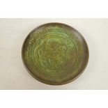 A Chinese bronze pin tray chased and engraved with a dragon and phoenix, 3" diameter