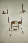 A pair of wrought iron two light candlesticks, 28" high, together with a riveted iron wall bracket