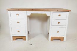 A painted pine kneehole desk with six drawers, 56" x 20½", 31" high