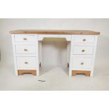 A painted pine kneehole desk with six drawers, 56" x 20½", 31" high