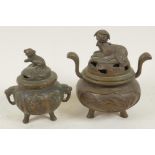 Two small Chinese bronze censers with cast covers, largest 3½" high