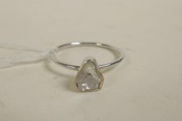 A silver ring set with a triangular uncut diamond, approximate size 'O/P'