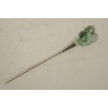 A carved hardstone hairpin on metal pin, the head carved as a dragon, 7" long