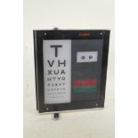 An optician's portable optical light box, by Sussex Vision, 11½" x 13"