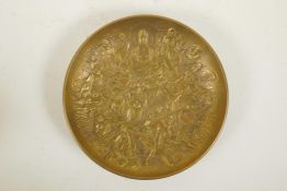 A Chinese bronze bowl with raised decoration of Buddha and eighteen Lohan, impressed seal mark to