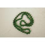 A string of jade beads, 33" long