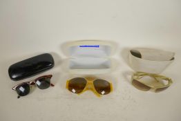 Three pairs of designer sunglasses, Eley Kishimoto, Iceberg and one other