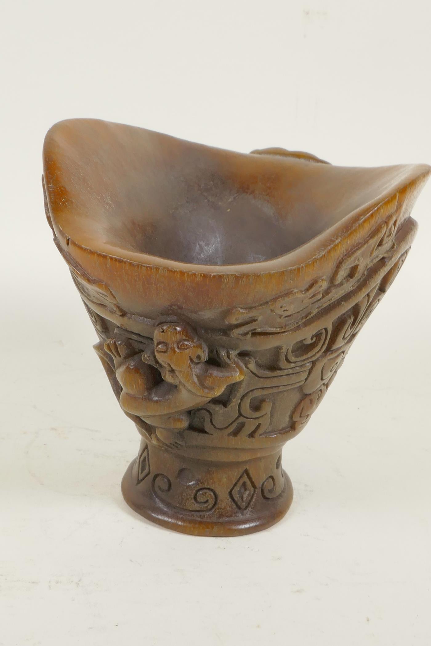 A Chinese faux horn libation cup decorated with archaic symbols and exotic beasts, 5" high - Image 2 of 4