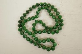 A string of jade beads, 33" long