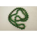 A string of jade beads, 33" long