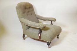 A Victorian upholstered mahogany armchair with turned arm and front supports on later shepherd