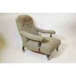 A Victorian upholstered mahogany armchair with turned arm and front supports on later shepherd