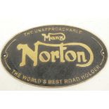 A replica cast metal advertising sign for Norton Motorcycles, 13" x 8"