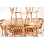 A pine scullery table and six matching spindle back chairs, 59½" x 33½", 31" high, with detachable