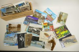 A quantity of assorted vintage postcards including topographical and social history, 6" x 4"