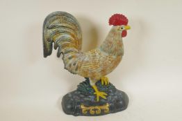 A painted cast iron doorstop in the form of a cockerel, 13½" high