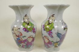 A pair of Chinese crackleware vases decorated with children, seal mark to base, 9" high