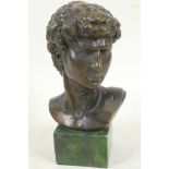 A bronze bust after the antique, head of David mounted on a plinth, 7" high