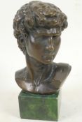 A bronze bust after the antique, head of David mounted on a plinth, 7" high