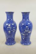 A pair of C19th Chinese blue and white porcelain vases, decorated with objects of virtu on a