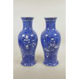 A pair of C19th Chinese blue and white porcelain vases, decorated with objects of virtu on a