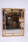 A giltwood sectional wall mirror, 34" x 42", A/F minor damage, fitted with antiqued glass