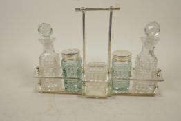 An Art Deco style silver plate and glass five piece cruet set