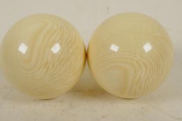 Two composition billiard balls, 2" diameter (164 grams)