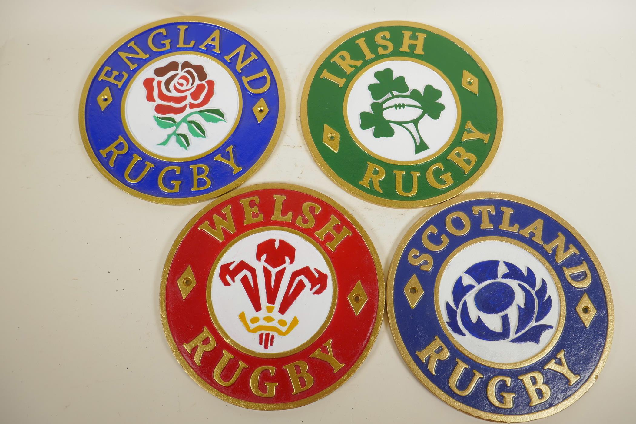 A set of four cast iron plaques depicting the Four Nations Rugby Union teams, 9.5" diameter