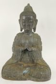 A good Chinese bronze figure of Buddha seated in meditation, his clothing moulded with Buddha