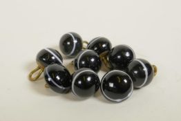 Nine Victorian black banded agate buttons